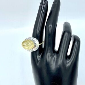 Pale yellow crystal ring I clear crystal setting with flexible band size 7